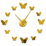 horloge papillon doré
